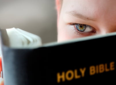 Boy Reading the holy bible