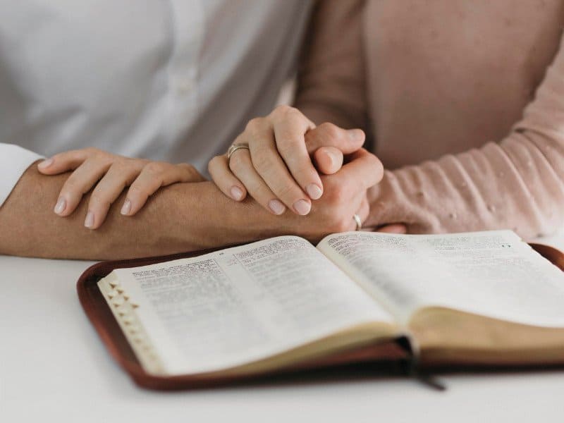 Husband and wife reading the Bible Husband and wife reading the Bible